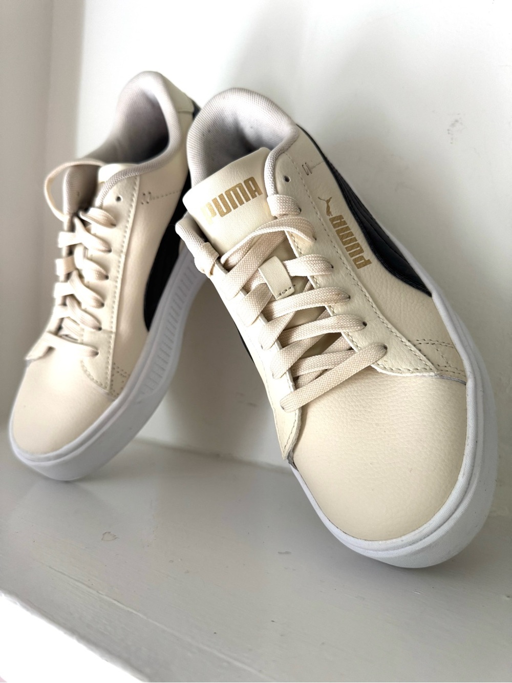 Puma Cream and Black Low-Top Sneakers